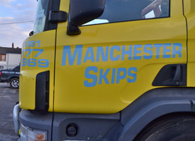 Picture of a Skip being loaded in Manchester