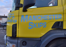 Picture of a Skip being loaded in Manchester